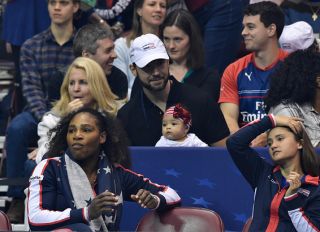 ASHEVILLE, NC - FEBRUARY 10: Serena Williams of Team USA, bottom left, along with her husband Alexis Ohanian and their daughter Alexis Olympia, center, watch the action during the first round of the 2018 Fed Cup at US Cellular Center on February 10, 2018 in Asheville, North Carolina.