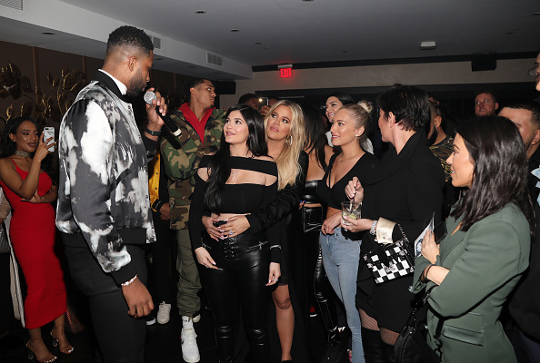 LOS ANGELES, CA - MARCH 10:  Tristan Thompson blows out his birthday candles as Khloe Kardashian, Kylie Jenner, Kris Jenner and friends look on at Remy Martin Presents Tristan Thompson's Birthday at Beauty & Essex on March 10, 2018 in Los Angeles, California.