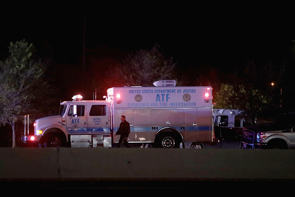ROUND ROCK, TX - MARCH 21: Law enforcement officials investigate at the location where the suspected package bomber was killed in suburban Austin on March 21, 2018 in Round Rock, Texas. The 24-year-old suspect blew himself up inside his car as police approached the vehicle. A massive search had been underway by local and federal law enforcement officials in Austin and the surrounding area after several package bombs had detonated in recent weeks, killing two people and injuring several others.