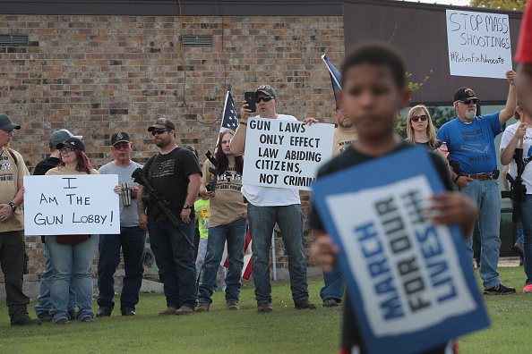 KILLEEN, TX - MARCH 24:  Advocating for the rights of gun owners, a group of demonstrators stage a counter-protest near a March for Our Lives rally on March 24, 2018 in Killeen, Texas. More than 800 March for Our Lives events, organized by survivors of the Parkland, Florida school shooting on February 14 that left 17 dead, are taking place around the world to call for legislative action to address school safety and gun violence. 