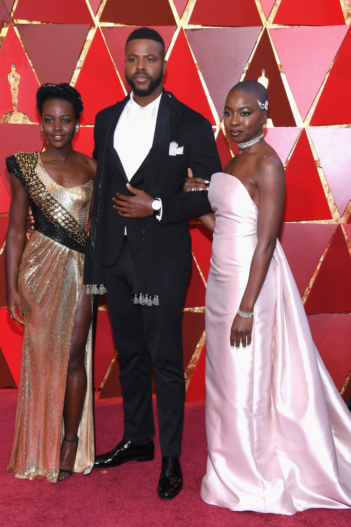 HOLLYWOOD, CA - MARCH 04: (L-R) Lupita Nyong'o, Winston Duke, and Danai Gurira attend the 90th Annual Academy Awards at Hollywood & Highland Center on March 4, 2018 in Hollywood, California. 