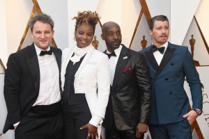 HOLLYWOOD, CA - MARCH 04: (L-R) Jason Clarke, Dee Rees, Rob Morgan, and Garrett Hedlund attend the 90th Annual Academy Awards at Hollywood & Highland Center on March 4, 2018 in Hollywood, California.