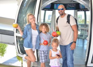 Kendra Wilkinson, husband Hank Baskett and children Little Hank and Alijah ride the High Roller Observation Wheel in Las Vegas.