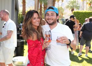 PALM SPRINGS, CA - APRIL 14: Brooke Burke (L) and Daniel Sena attend Interscope Coachella House 2018 on April 14, 2018 in Palm Springs, California.
