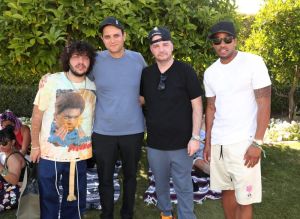 PALM SPRINGS, CA - APRIL 14: (L-R) Benny Blanco, CEO Interscope Records John Janick, Joie Manda, and Tim Glover attend Interscope Coachella House 2018 on April 14, 2018 in Palm Springs, California.