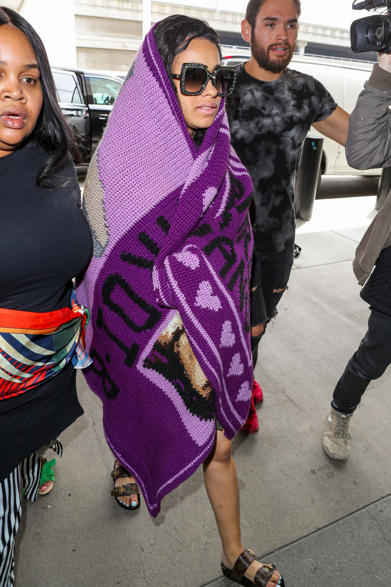 Cardi B seen at LAX Airport with her purple blanket in Los Angeles