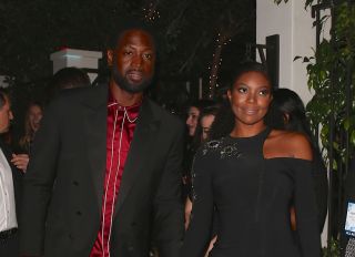 Dwyane Wade & wife Gabrielle Union exit Pre Emmy event hand and hand.