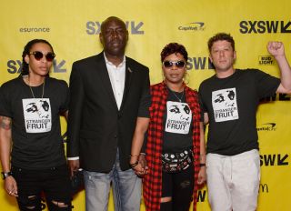 AUSTIN, TX - MARCH 11: KeyAnna Ewing, Mike Brown's attorney Benjamin Crump, Mike Brown's mother Lezley McSpadden and director Jason Pollock walk the red carpet at the SxSW Film Festival premier of Stranger Fruit at the Austin Convention Center on March 11, 2017 in Austin, Texas.