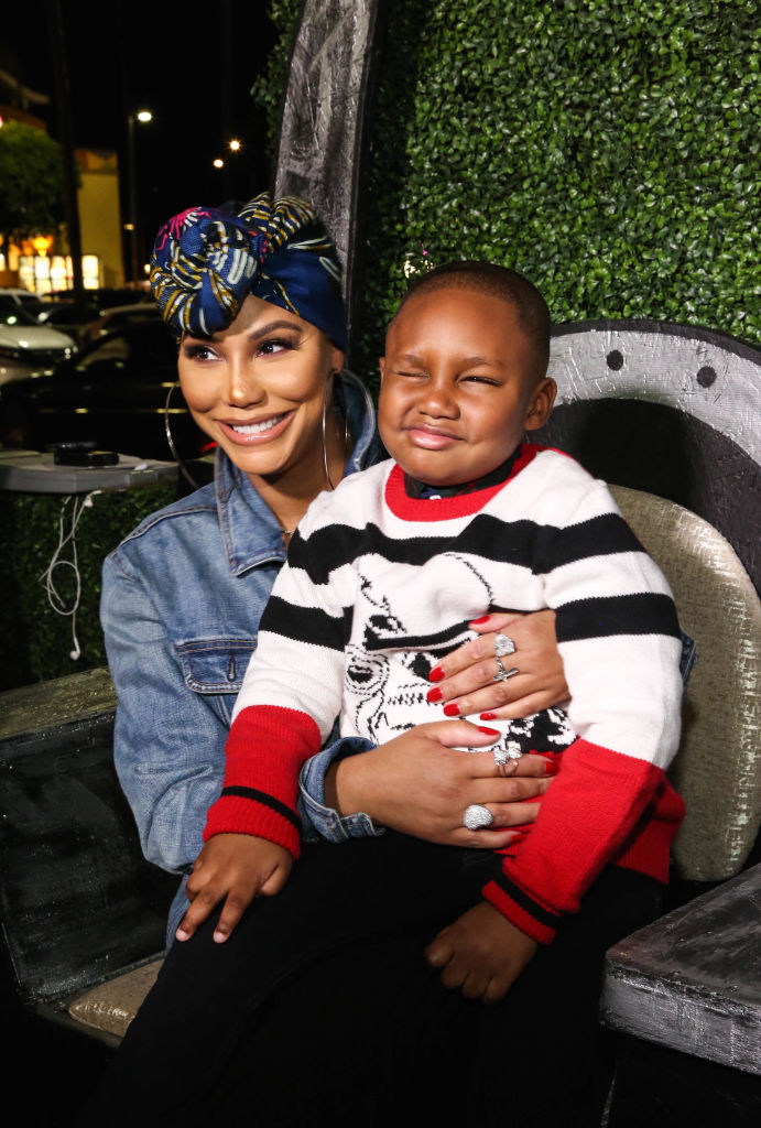 LOS ANGELES, CA - FEBRUARY 14:  Tamar Braxton and son Logan Vincent Herbert attend the Pan African Film Festival red carpet and screening of Marvel Studios 