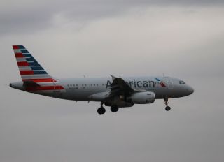 flight attendant sues american airlines dragged aisle