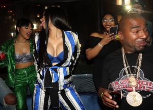 NEW YORK, NY - APRIL 10: Cardi B (2nd L) and N.O.R.E. (r) attend the CARDI B "Gold Album" Release Party at Moxy Hotel on April 10, 2018 in New York City.