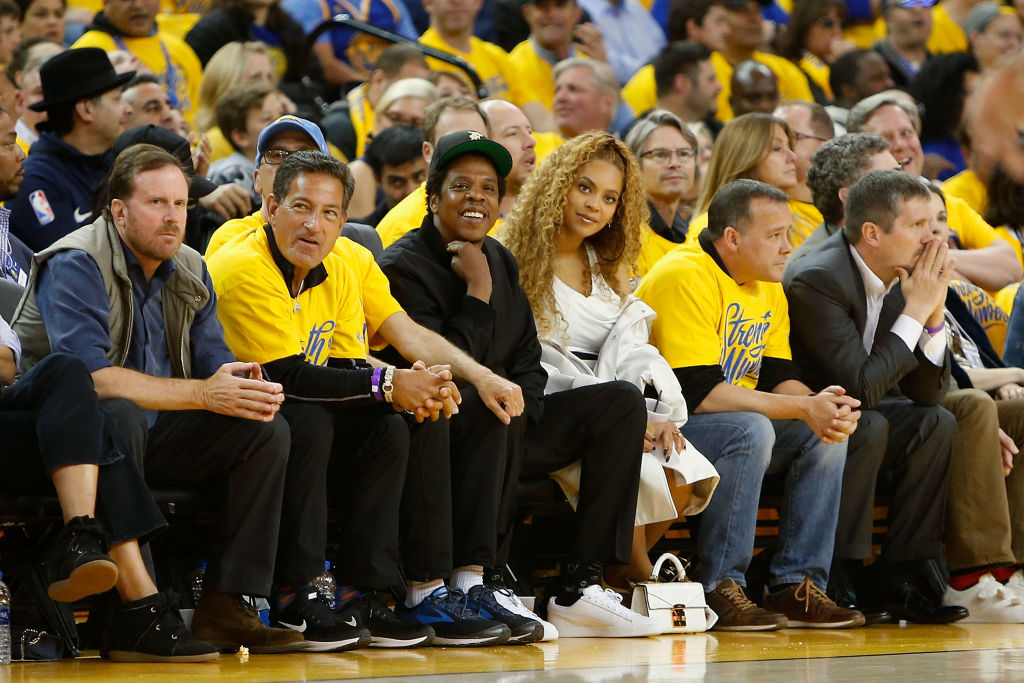 OAKLAND, CA - APRIL 28: Entertainers Jay-Z and Beyonce look on during Game One of the Western Conference Semifinals between the New Orleans Pelicans and the Golden State Warriors at ORACLE Arena on April 28, 2018 in Oakland, California.  