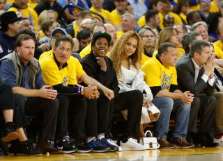 OAKLAND, CA - APRIL 28: Entertainers Jay-Z and Beyonce look on during Game One of the Western Conference Semifinals between the New Orleans Pelicans and the Golden State Warriors at ORACLE Arena on April 28, 2018 in Oakland, California.