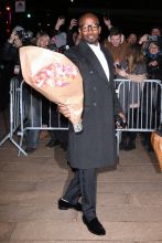 Actor Jamie Foxx, carrying a dozen roses, attends Dolce & Gabbana Alta Moda at Lincoln Center in New York City, New York on April 8, 2018.