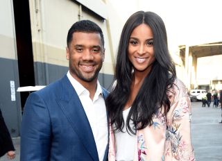 LOS ANGELES, CA - OCTOBER 14: In this handout photo provided by One Voice: Somos Live!, NFL player Russell Wilson and singer Ciara pose backstage during "One Voice: Somos Live! A Concert For Disaster Relief" at the Universal Studios Lot on October 14, 2017 in Los Angeles, California.