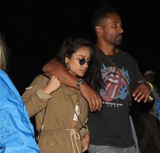 Shay Mitchel and Mystery Man try to hide from paparazzi while arriving to neon carnival in Palm Desert CA