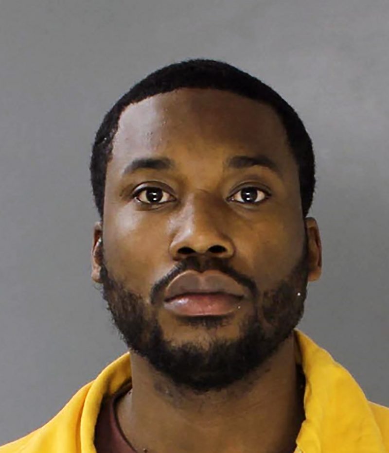 The latest prison photo of Meek Mill (Robert Rihmeek Williams) who is incarcerated after a judge sentenced him to 2-4 years for repeatedly violating his probation following a drug and gun conviction in 2008. The rapper is being held in a facility in Montgomery County, a Philadelphia suburb. The 30-year-old hip-hop artist wears the regulation yellow jumpsuit given to newly received inmates. He entered a Philadelphia courtroom on Monday [Nov 6, 2017] for a hearing about the violations of his 5-year parole from the 2008 conviction. He was accused of failing a drug test, plus failure to comply with a court order restricting his travel. Prosecutors cited unapproved travel to New York for a benefit concert and efforts to join Nicki Minaj, his then-girlfriend, in several unproved locations. He was also accused of submitting water instead of urine for a drug test. Common Pleas Judge Genece Brinkley reportedly told the rapper: "I've been trying to help you since 2009...You basically thumbed your nose at me". Meek admitted to battling addiction to the prescription painkiller Percocet.