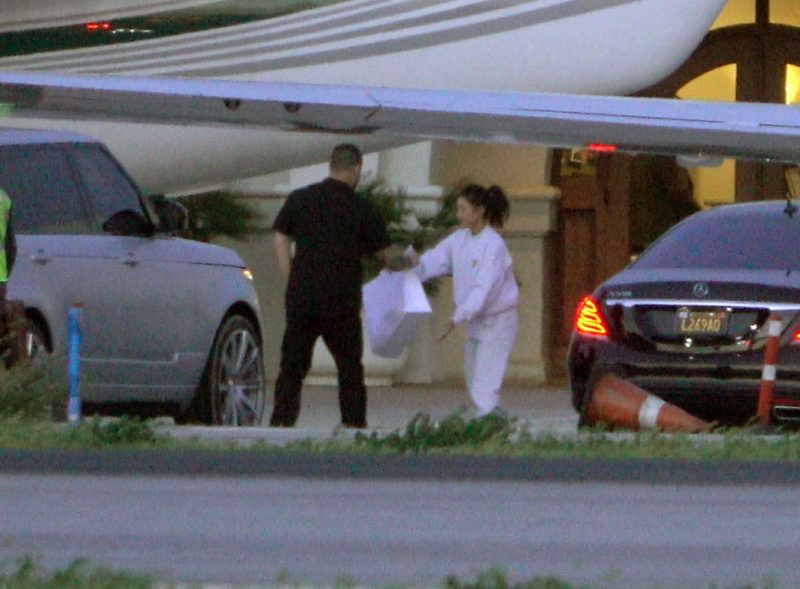 Kourtney Kardashian hands over gift bags to security and assistants after returing from visiting her new niece and sister Khloe Kardashian in Cleveland. Kourtney was spotted getting into her own car as she held onto the big packages and then handed it over to her sister Kim's Range Rover before heading off back to Calabasas after their first visit to their latest family member.