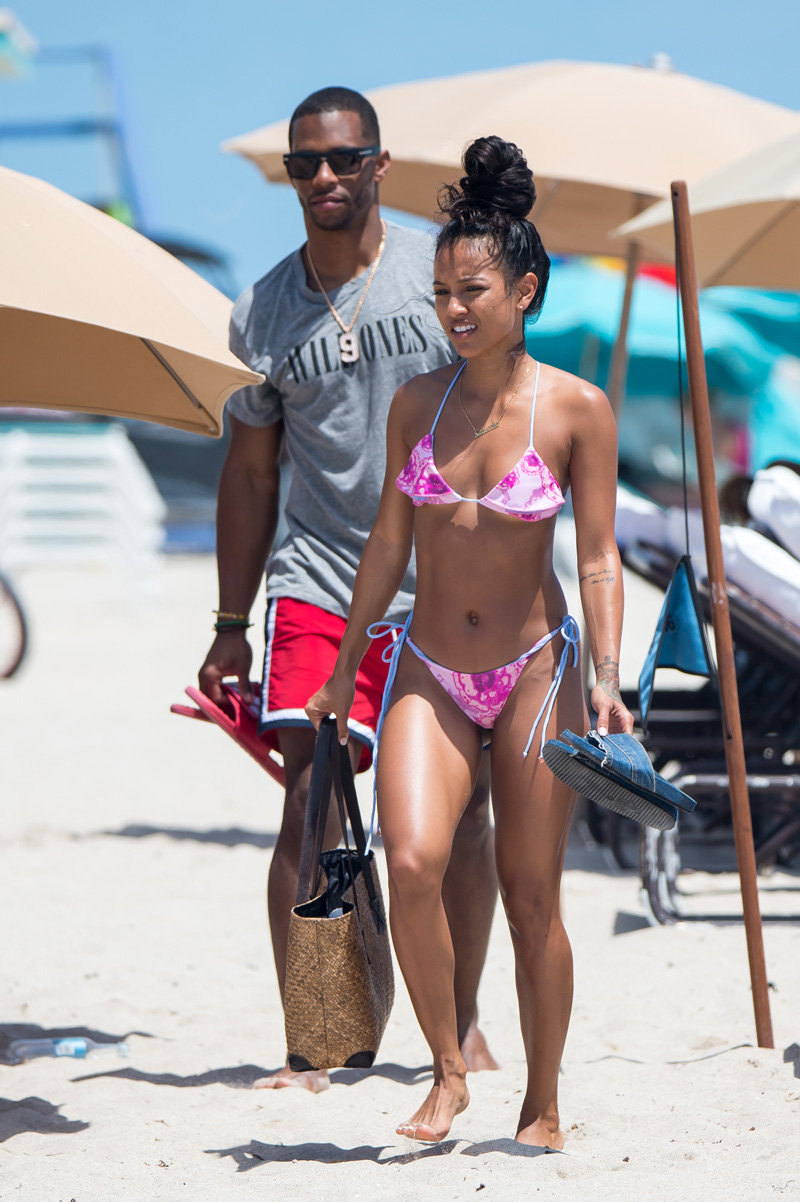 Karrueche Tran and her boyfriend NFL free agent Victor Cruz are seen during a beach day in Miami. Karrueche Tran was seen wearing a small golden necklace with her name written on it. The 29 year old actress has been filming her TNT show Claws.
