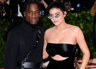 Kylie Jenner and Travis Scott at 2018 Met Gala celebrating the exhibition 'Heavenly Bodies: Fashion and the Catholic Imagination' at the Metropolitan Museum of Art in New York