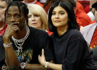 HOUSTON, TX - APRIL 18: Travis Scott and Kylie Jenner sit court-side during Game Two of the first round of the Western Conference playoffs at Toyota Center on April 18, 2018 in Houston, Texas.