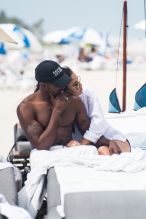 Newly Weds Shanina Shaik and and husband DJ Ruckus on Miami Beach just a few days after getting married in the Bahamas a with their adorable dog.
