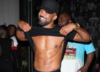 Actor Shemar Moore shows off his muscular stomach and abs as he leaves Catch restaurant after having dinner in West Hollywood.