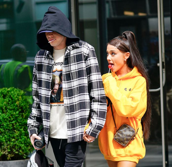 Ariana Grande and Pete Davidson mirror each other by sucking on lollipops and holding hands when out and about in New York