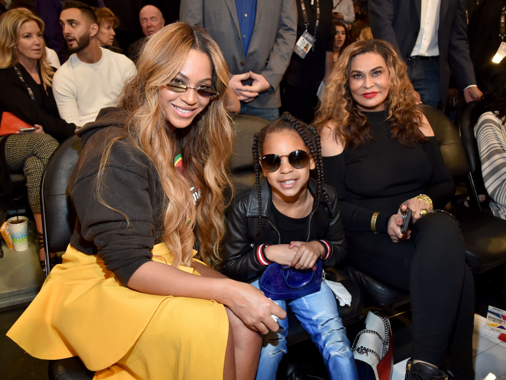 LOS ANGELES, CA - FEBRUARY 18:  (L-R) Beyonce, Blue Ivy Carter, and Tina Knowles attend the 67th NBA All-Star Game: Team LeBron Vs. Team Stephen at Staples Center on February 18, 2018 in Los Angeles, California. 