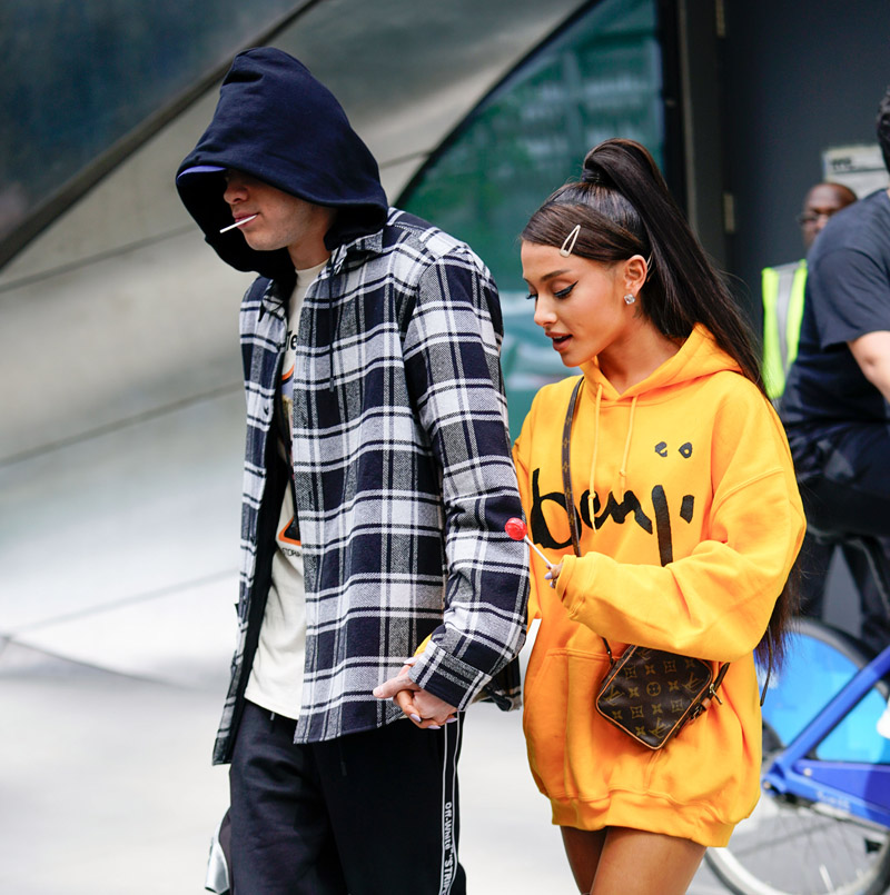 Ariana Grande and Pete Davidson mirror each other by sucking on lollipops and holding hands when out and about in New York