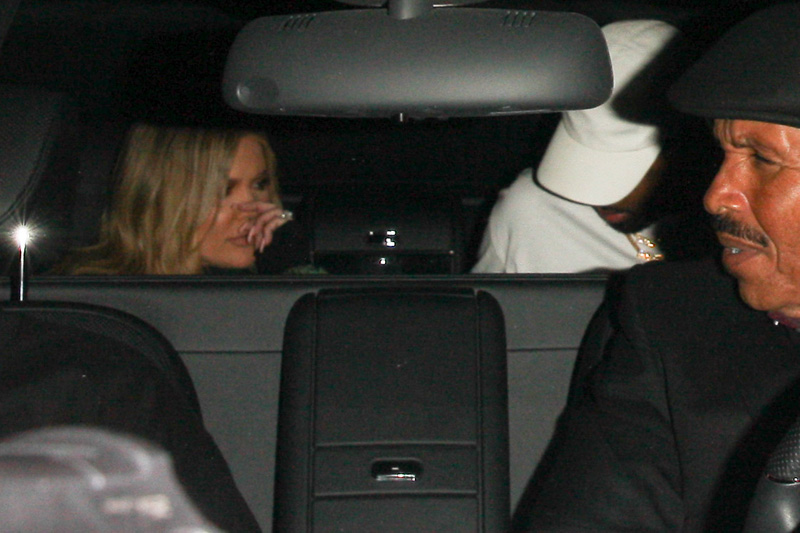 Reality star Khloe Kardashian and NBA star boyfriend Tristan Thompson are  spotted out partying together after dinner in Los Angeles, CA.  The couple are seen at the back of a car.