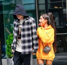 Ariana Grande and Pete Davidson mirror each other by sucking on lollipops and holding hands when out and about in New York