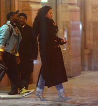Rihanna was spotted leaving her NYC apartment before heading to Madison Square Garden to attend the first Roc Nation Boxing event. She carried a glass of red wine in her hand as she strutted out in to the freezing weather.