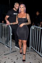 Amber Rose shows off her new Purple hair Style in a LBD as she was seen leaving 'Ace of Diamonds' strip club in West Hollywood, CA