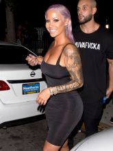 Amber Rose shows off her new Purple hair Style in a LBD as she was seen leaving 'Ace of Diamonds' strip club in West Hollywood, CA