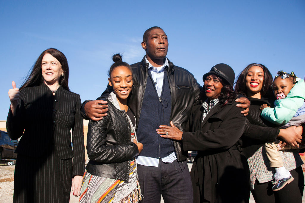 Darryl Fulton holds back tears as he describes the feeling of being released from Menard Correctional Facility on Nov. 20, 2017 in Chester, Ill. Fulton has spent 8,607 days in prison after a 1994 wrongful murder and rape conviction. Fulton is surrounded by his family and lawyer, from left, Kathleen Zellner, daughter Jaszulyn Fulton, mother Dorothy Davis, niece Imone Griffin and great-niece Peoria Barber.