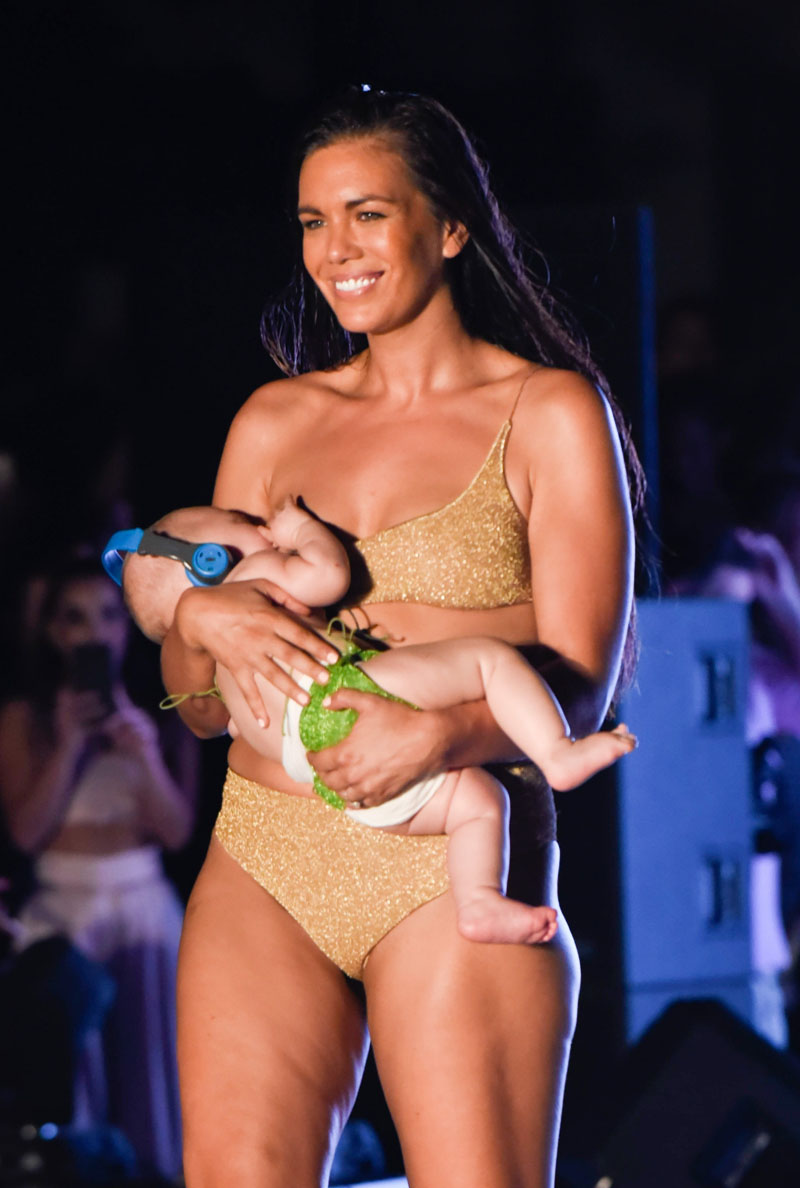 Bikini model  Mara Martin breastfeeds a baby on runway at Sports Illustrated's swimsuit show in Miami.  The stunner was seen nursing the newborn during the show at PARAISO during Miami Swim Week at The W Hotel South Beach on July 15, 2018 .