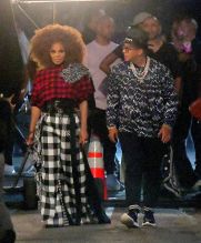 Janet Jackson was spotted on set of a New Music Video in Brooklyn on Thursday evening in New York, NY, USA. She filmed an exterior scene with Daddy Yankee, where they danced in the streets, as their music played. Janet wore a Big Puffy afro, and a plaid ensemble for this scene.