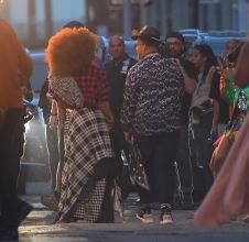 Janet Jackson was spotted on set of a New Music Video in Brooklyn on Thursday evening in New York, NY, USA. She filmed an exterior scene with Daddy Yankee, where they danced in the streets, as their music played. Janet wore a Big Puffy afro, and a plaid ensemble for this scene.