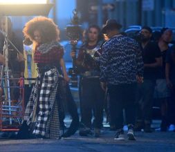 Janet Jackson was spotted on set of a New Music Video in Brooklyn on Thursday evening in New York, NY, USA. She filmed an exterior scene with Daddy Yankee, where they danced in the streets, as their music played. Janet wore a Big Puffy afro, and a plaid ensemble for this scene.