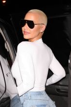 Ace of Diamonds club in Los Angeles, CA. Amber Rose proudly showed off her cleavage and curvy figure as she left the club.