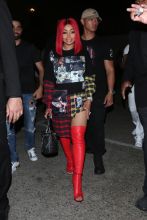 Blac Chyna proudly shows off her new red hair as she leaves the Ace of Diamonds club in Los Angeles, CA.