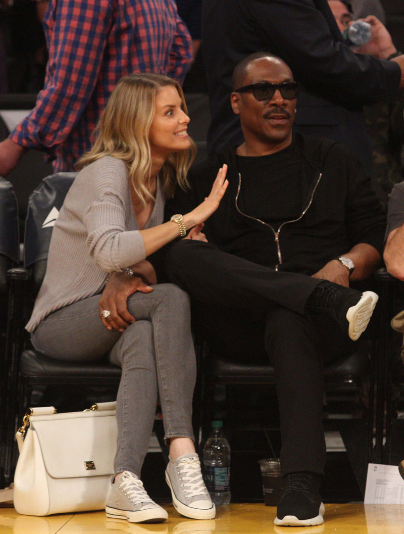 Eddie Murphy and Paige Butcher out at the Lakers game. Jazz 112 Lakers 97 Staples Center LA CA 4/8/18