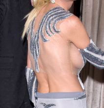 Actress Tara Reid seen at Delilah Night Club dressed in a Silver colored designer evening gown holding on the arm of her boyfriend. Tara has recently been promoting her latest installment of the movie 'Sharknado'