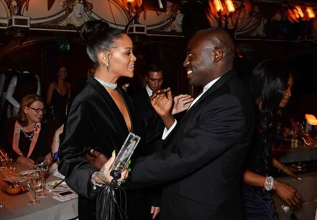 LONDON, ENGLAND - DECEMBER 01: Rihanna (L) and Edward Enninful attend a drinks reception at the British Fashion Awards at the London Coliseum on December 1, 2014 in London, England.