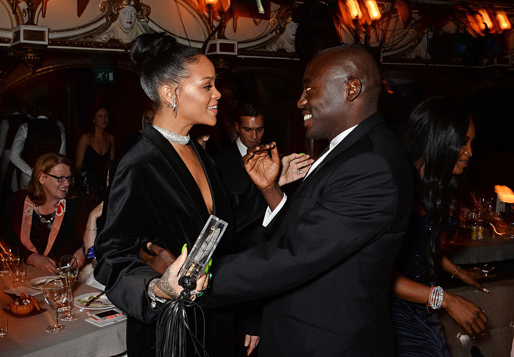LONDON, ENGLAND - DECEMBER 01:  Rihanna (L) and Edward Enninful attend a drinks reception at the British Fashion Awards at the London Coliseum on December 1, 2014 in London, England. 