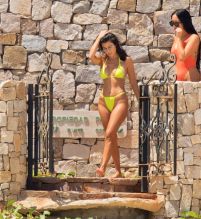 Kourtney Kardashian beach Mexico bright yellow bikini