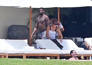 Khloe Kardashian and Kendall Jenner are joined by Tristan Thompson, Ben Simmons and friends at Joe Francis's home in Mexico. The sisters and their boyfriends lounged around at the luxury beachfront mansion, rode on jet ski's and even jokingly gave the bird to photographers.