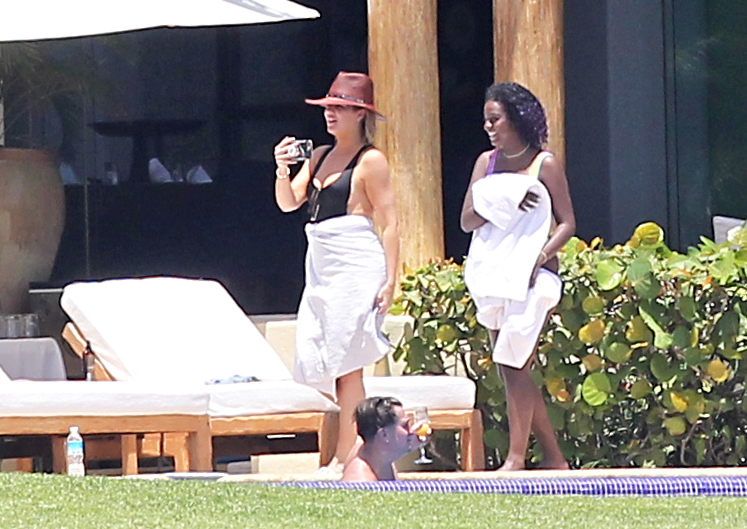 Khloe Kardashian and Kendall Jenner are joined by Tristan Thompson, Ben Simmons and friends at Joe Francis's home in Mexico. The sisters and their boyfriends lounged around at the luxury beachfront mansion, rode on jet ski's and even jokingly gave the bird to photographers.