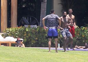 Khloe Kardashian and Kendall Jenner are joined by Tristan Thompson, Ben Simmons and friends at Joe Francis's home in Mexico. The sisters and their boyfriends lounged around at the luxury beachfront mansion, rode on jet ski's and even jokingly gave the bird to photographers.